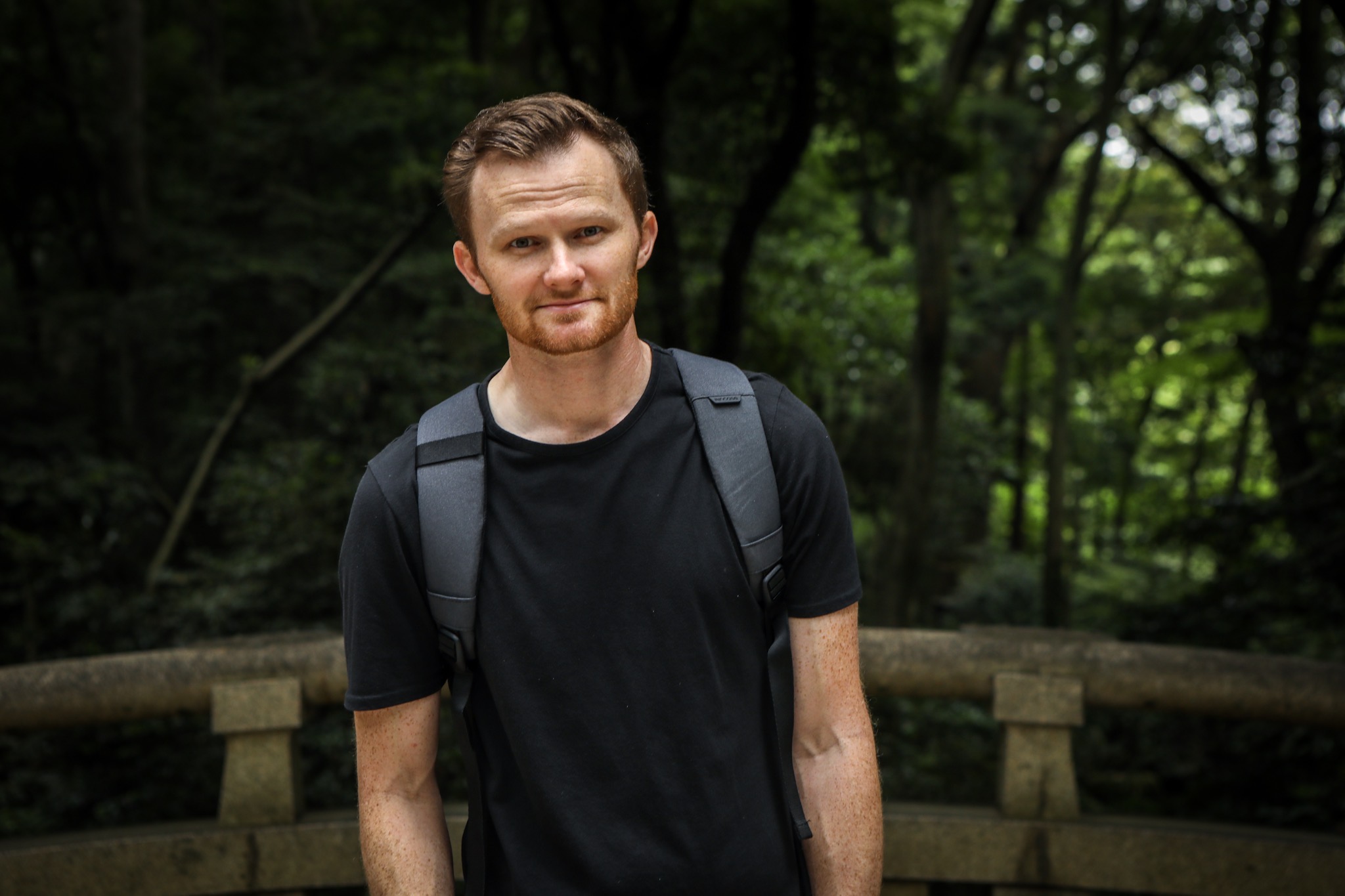 a picture of a freckled man in a backpack